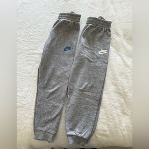 Nike Kids Gray Joggers with Blue and White Logos size 7